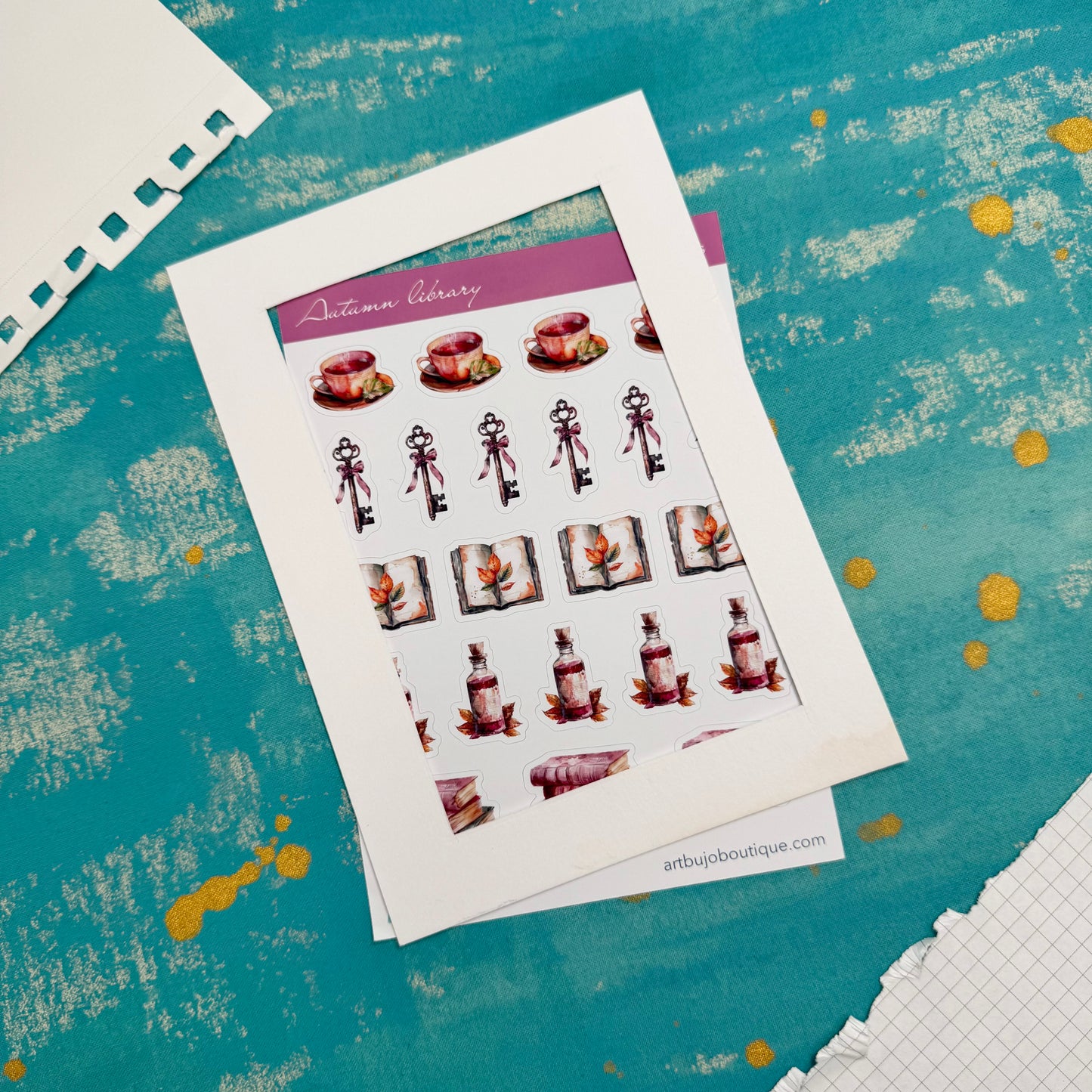 Sheet of decorative stickers on a textured blue surface