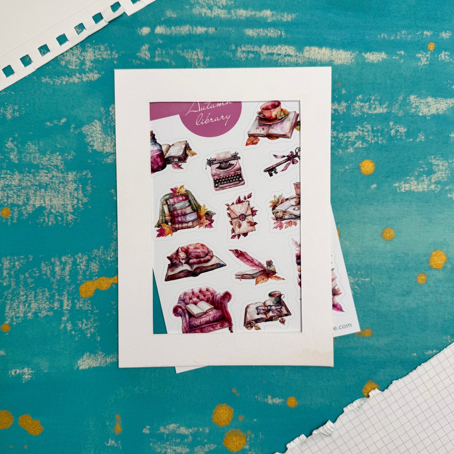 Sheet of decorative stickers on a textured blue surface
