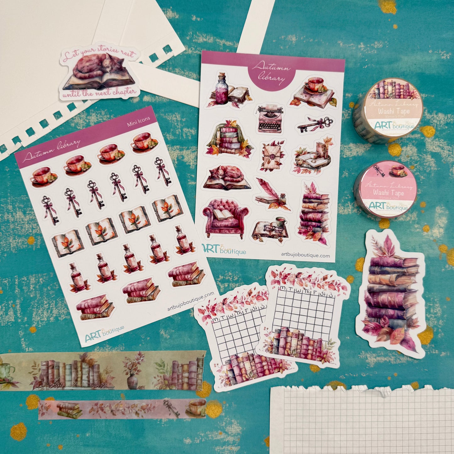Collection of decorative stickers and washi tape on a textured blue background