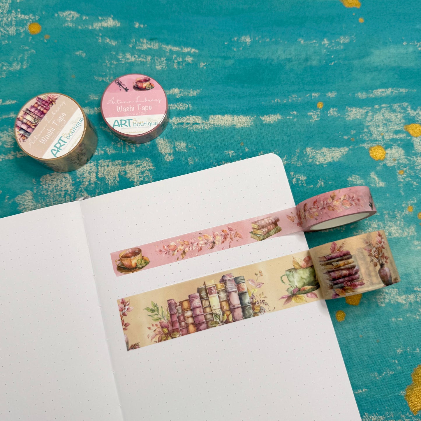 Decorative washi tape on a notebook with a colorful background
