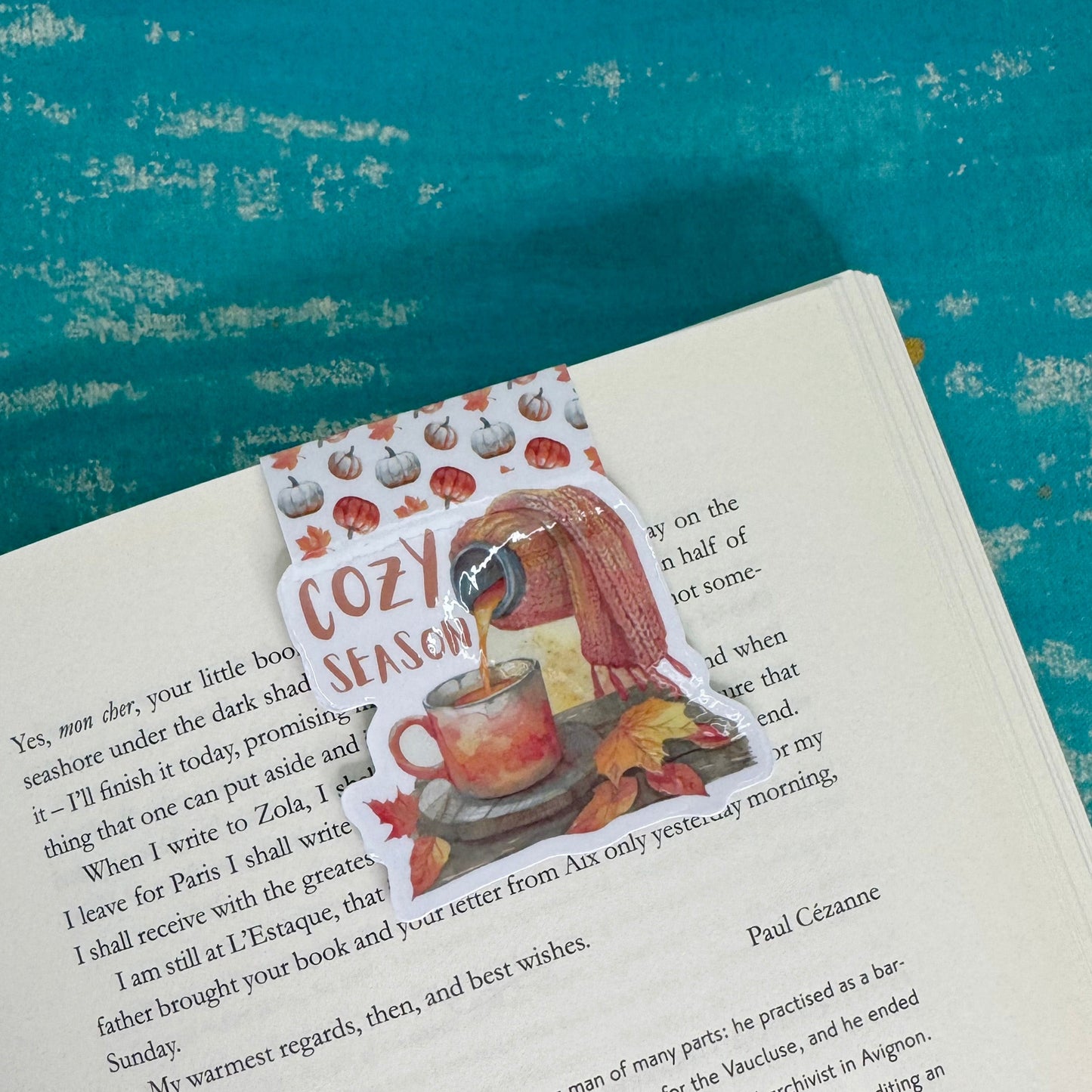 Book with a decorative sticker on a blue textured background