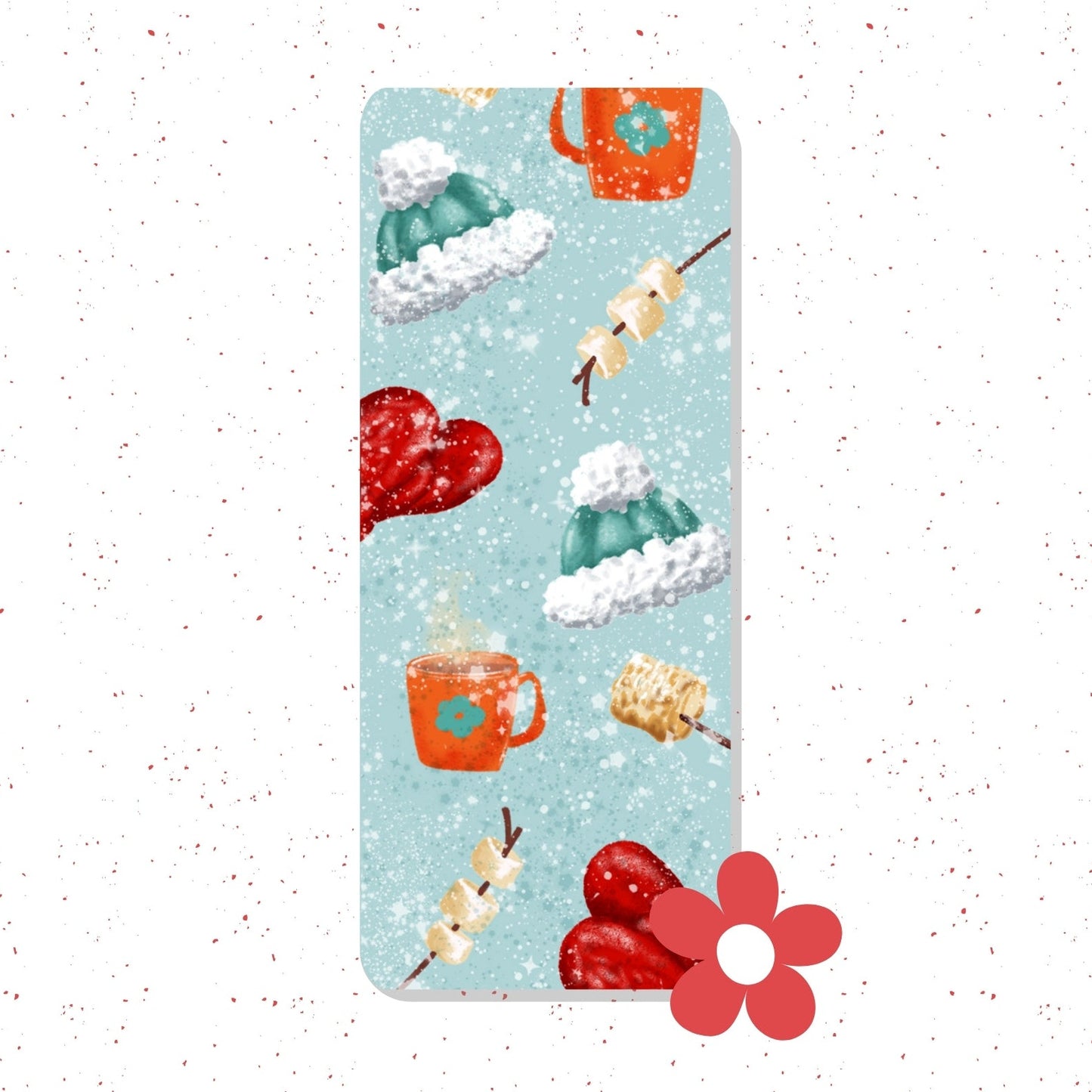 A vertical yoga mat with a light blue background and a winter-themed pattern featuring red mittens, green and white snow hats, an orange mug, and marshmallow skewers, shown on a white background with red speckles and a red flower graphic in the bottom right corner.