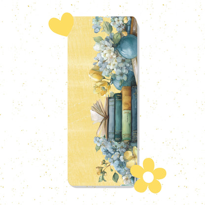 Decorative bookmark with floral design and books on a yellow background