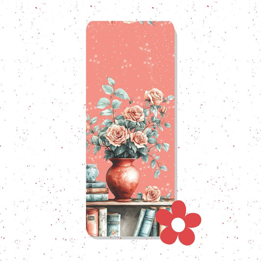 A tall, narrow decorative print or card featuring a watercolor-style floral arrangement in a terracotta vase on a pink background, with books at the bottom. The item is centered on a white speckled backdrop, and a red flower icon appears near the lower right.