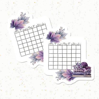Two die-cut planner stickers with watercolor purple and lavender floral designs, featuring a weekly grid from Monday to Friday at the top, shown on a light speckled background.