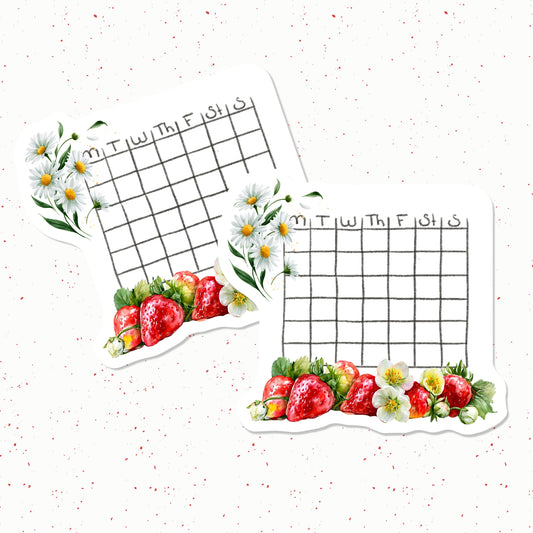 Two grid planners with strawberries and daisies on a white background