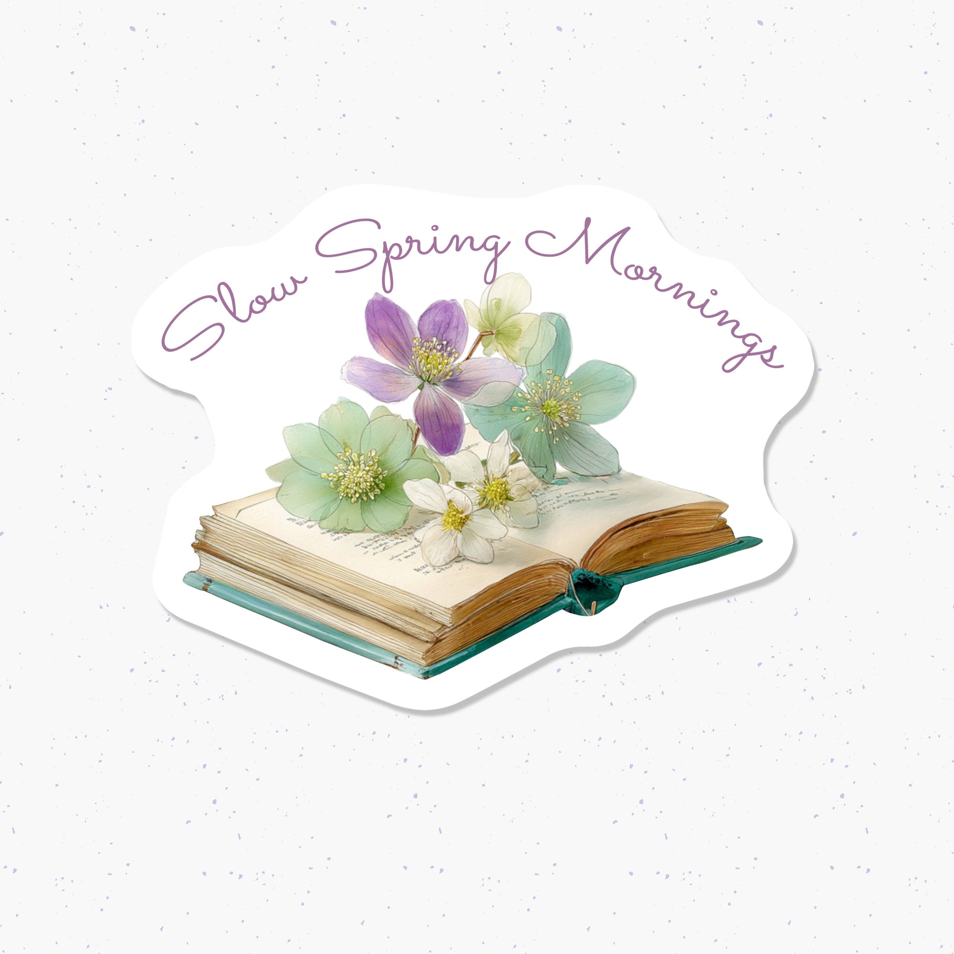 Decorative card with flowers on an open book, text 'Slow Spring Mornings', on a light background.