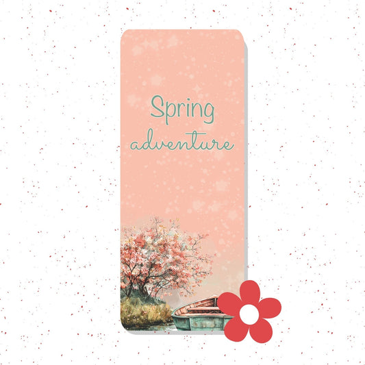 A vertical rectangular card or print with a peach-pink background, the words 'Spring adventure' in teal script, and a watercolor-style scene of a flowering tree and a small boat near the bottom. A red flower graphic sits at the lower right.
