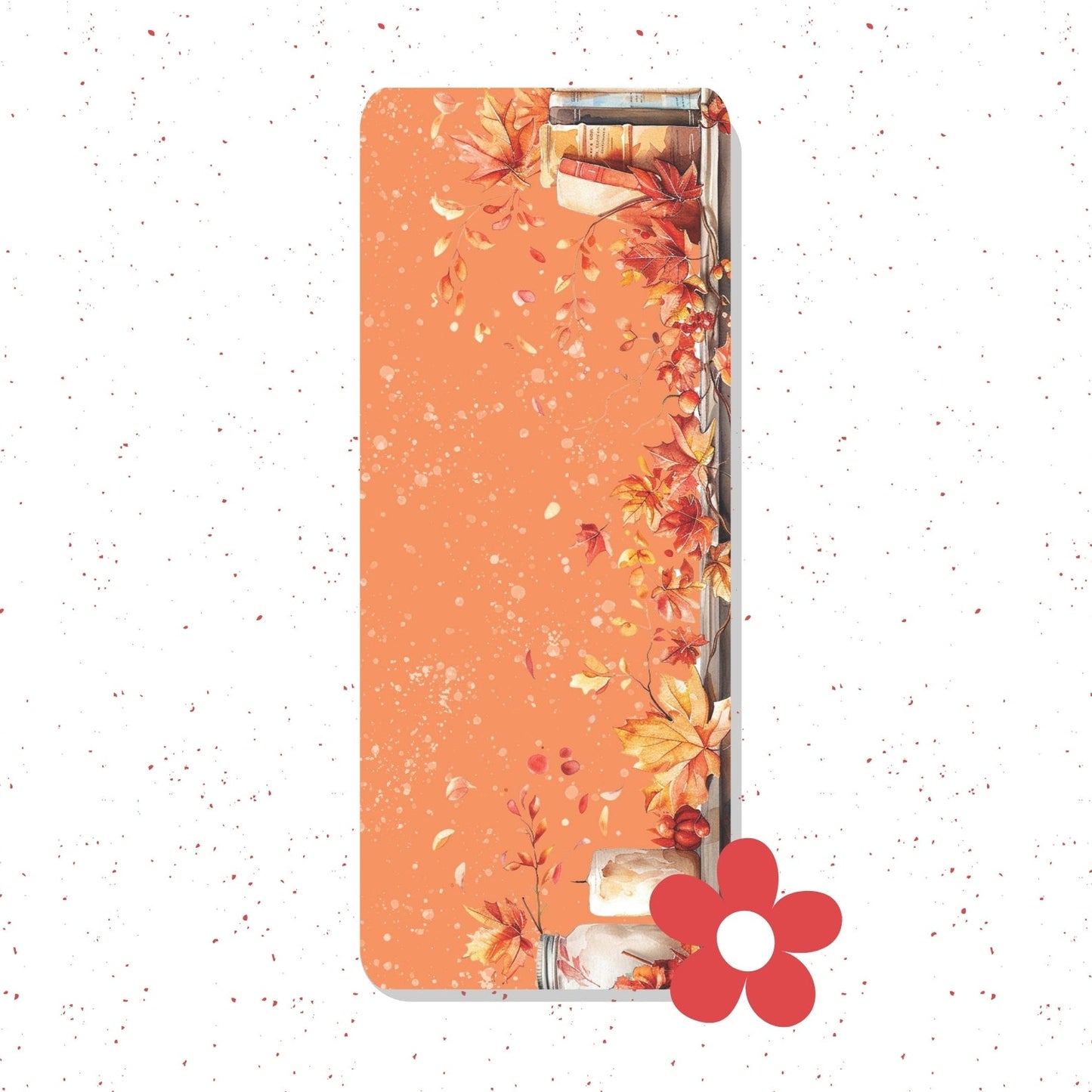 A slim rectangular phone case with a warm orange background and an autumn leaf print along the right side, shown on a white speckled background with a red flower graphic near the bottom right.