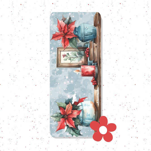 A rectangular yoga mat featuring a festive Christmas watercolor design with poinsettias, candles, berries, and a blue vase on a snowy light-blue background. The mat is shown flat against a white background with subtle red speckles and a red flower graphic in the bottom right corner.