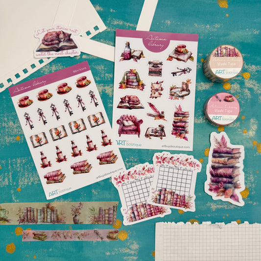 Collection of decorative stickers and washi tape on a textured blue background