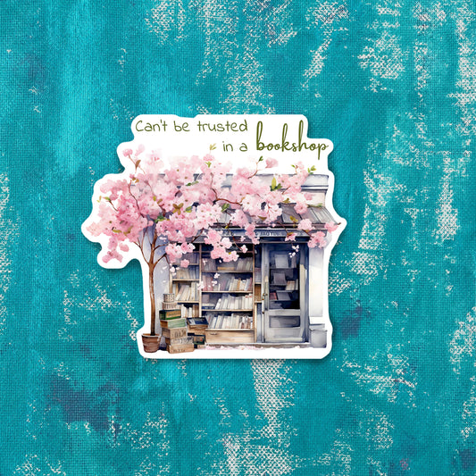 Illustration of a bookshop with cherry blossoms on a textured teal background