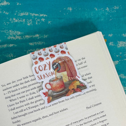 Book with a decorative sticker on a blue textured background