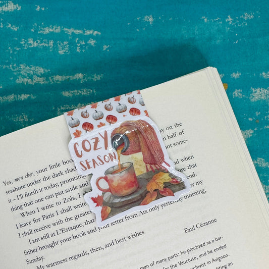 Book with a decorative sticker on a blue textured background