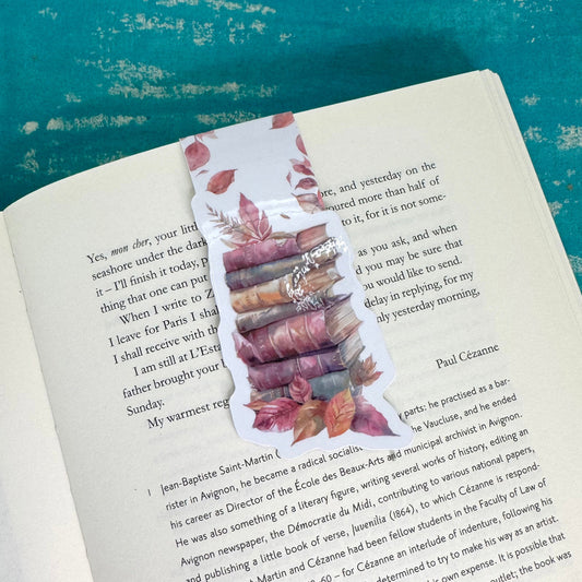 Book with a decorative bookmark on a textured blue surface