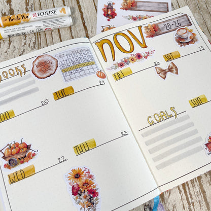 Planner weekly spread with stickers, autumn leaves and pumpkin stickers