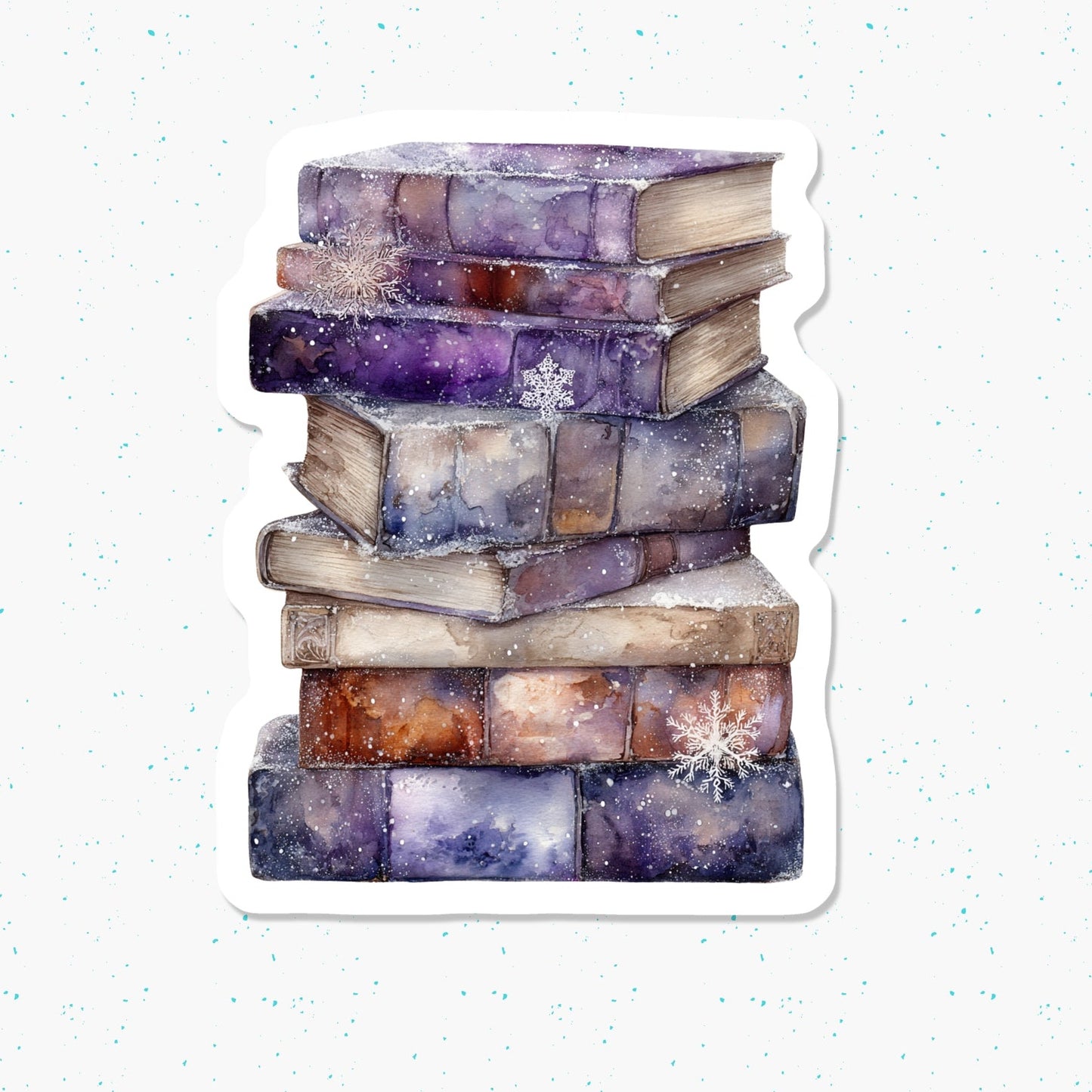 A die-cut sticker featuring a watercolor illustration of a stack of old books dusted with snow, set against a white background with subtle blue speckles.